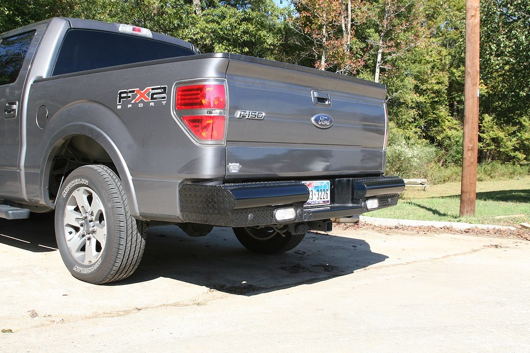 Fab Fours Bumper, Black Steel, One Piece Design, Mounting Hardware Included, With Two 6 Inch Oval LED Backup Lights – FF09-T1750-1