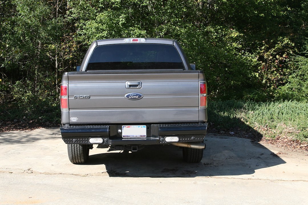 Fab Fours Bumper, Black Steel, One Piece Design, Mounting Hardware Included, With Two 6 Inch Oval LED Backup Lights – FF09-T1750-1