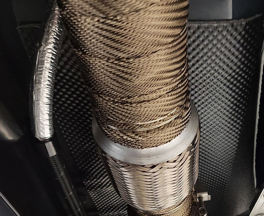 Design Eng Exhaust System Wrap, Titanium ™, 25 Foot Roll, 2 Inch Width, Carbon Fiber, Lava Rock Fiberglass – 10131